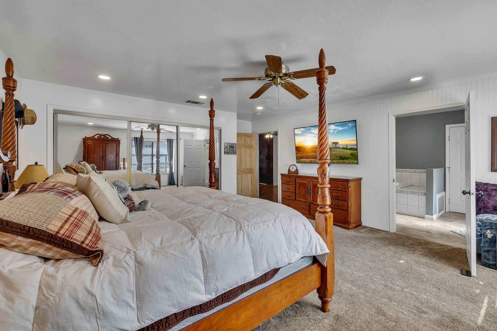 17681 Busher Way Tehachapi, CA 93561 - Photo 47 of 54 a bed room with a bed mirror and a television