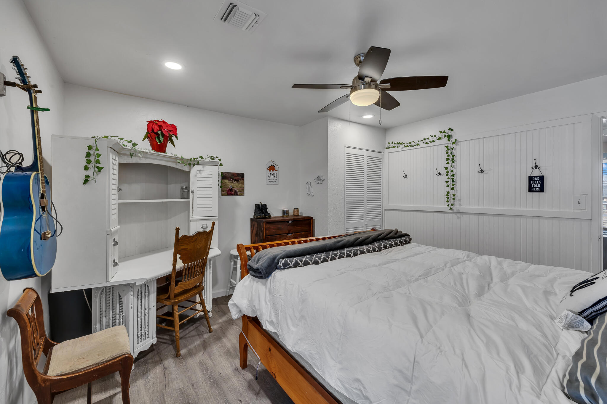 17681 Busher Way Tehachapi, CA 93561 - Photo 51 of 54 a bedroom with a bed and a chandelier