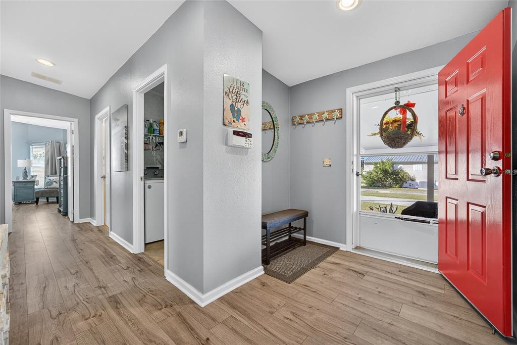 29221 Orangewood Street Punta Gorda, FL 33982 - Photo 13 of 38 a view of a hallway view with furniture and wooden floor