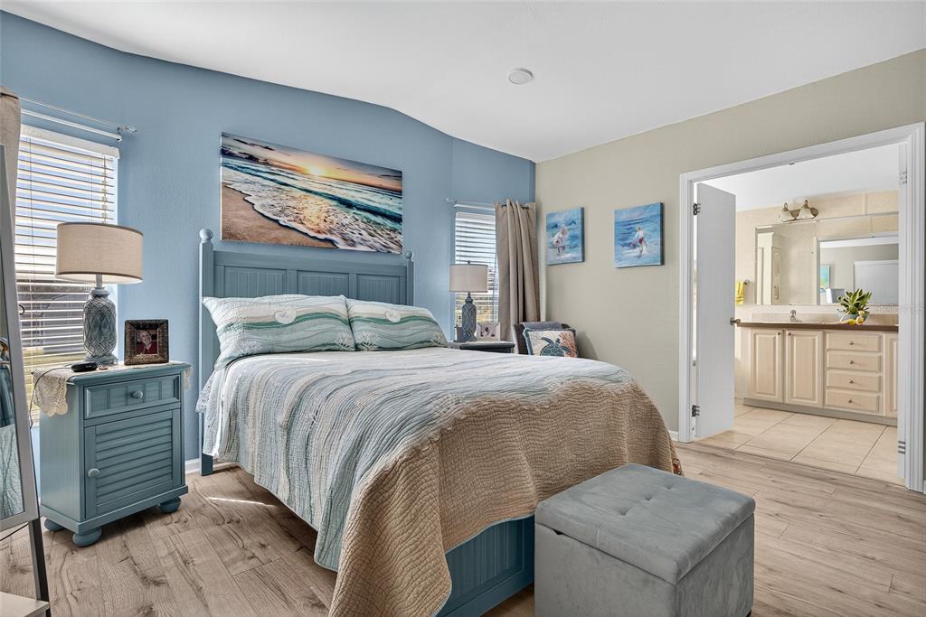 29221 Orangewood Street Punta Gorda, FL 33982 - Photo 15 of 38 a bedroom with a bed and a cabinets