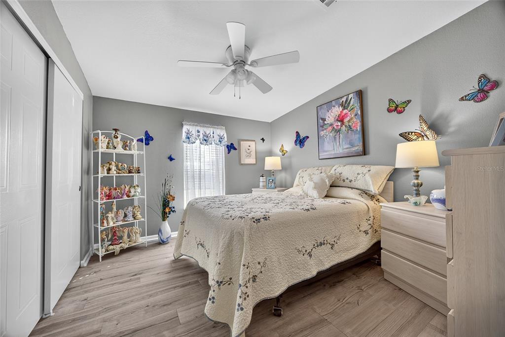 29221 Orangewood Street Punta Gorda, FL 33982 - Photo 18 of 38 a bedroom with a bed and a book shelf