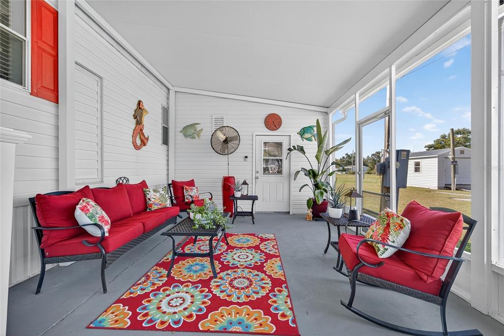 29221 Orangewood Street Punta Gorda, FL 33982 - Photo 21 of 38 a living room with furniture and a large window