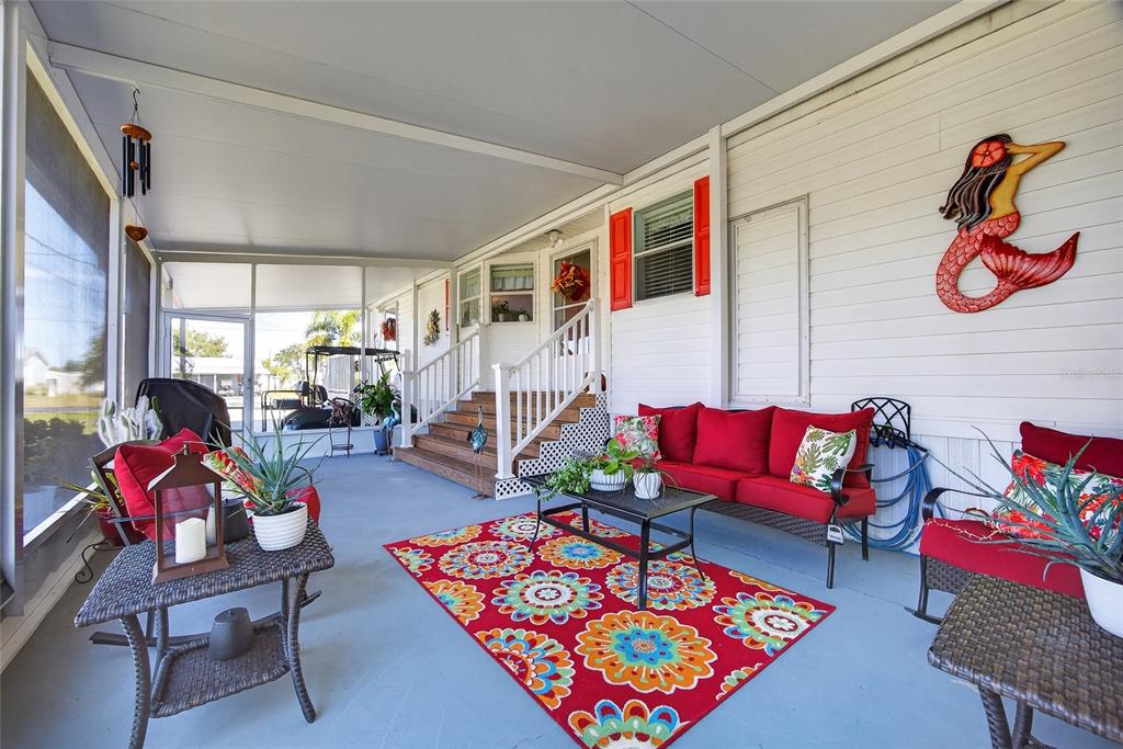 29221 Orangewood Street Punta Gorda, FL 33982 - Photo 22 of 38 a living room with lots of furniture and a rug