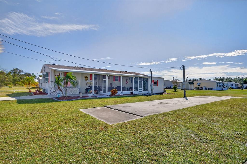 29221 Orangewood Street Punta Gorda, FL 33982 - Photo 25 of 38 a view of a swimming pool with an outdoor seating