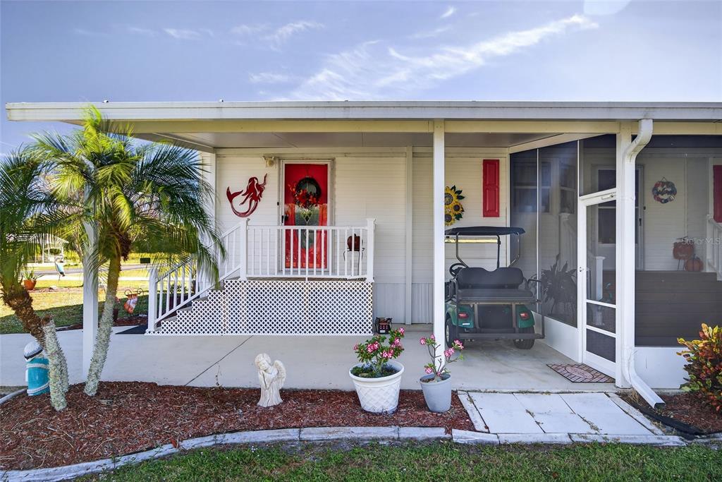 29221 Orangewood Street Punta Gorda, FL 33982 - Photo 27 of 38 a front view of a house with garden