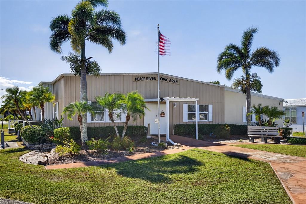 29221 Orangewood Street Punta Gorda, FL 33982 - Photo 32 of 38 a front view of a house with a yard garage and outdoor seating