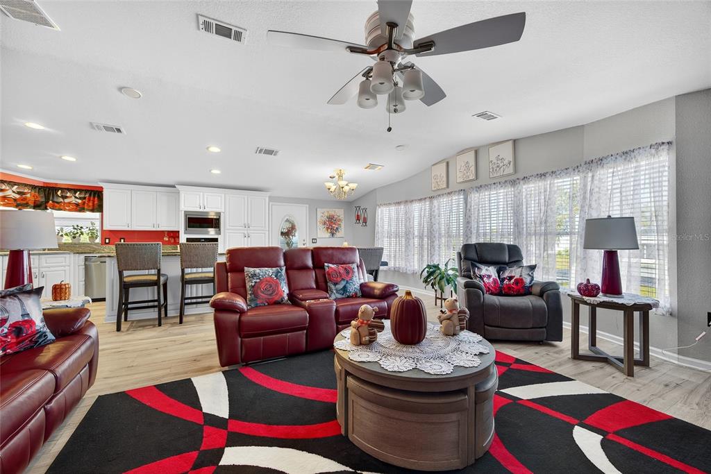 29221 Orangewood Street Punta Gorda, FL 33982 - Photo 5 of 38 a living room with furniture and a flat screen tv