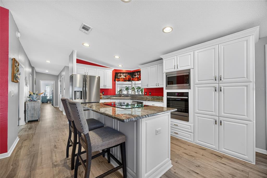 29221 Orangewood Street Punta Gorda, FL 33982 - Photo 9 of 38 a kitchen that has a cabinets counter space and appliances