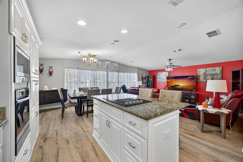 29221 Orangewood Street Punta Gorda, FL 33982 - Photo 10 of 38 a kitchen with stainless steel appliances granite countertop a stove and a refrigerator