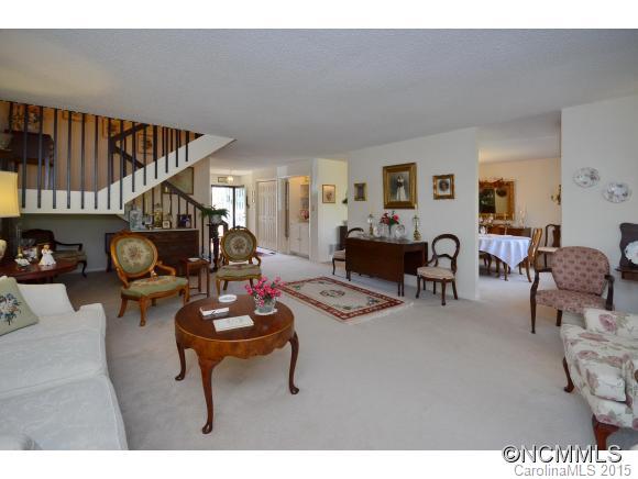 503 Crowfields Lane Asheville, NC 28803 - Photo 4 of 20 a living room with furniture a rug and a wooden floor
