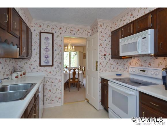 503 Crowfields Lane Asheville, NC 28803 - Photo 6 of 20 a kitchen with stainless steel appliances a sink stove and cabinets