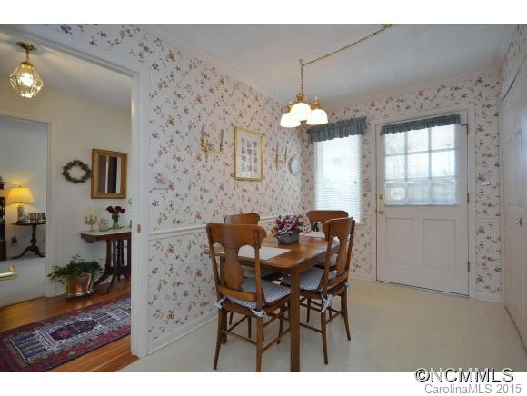 503 Crowfields Lane Asheville, NC 28803 - Photo 8 of 20 a view of a dining room with furniture and chandelier