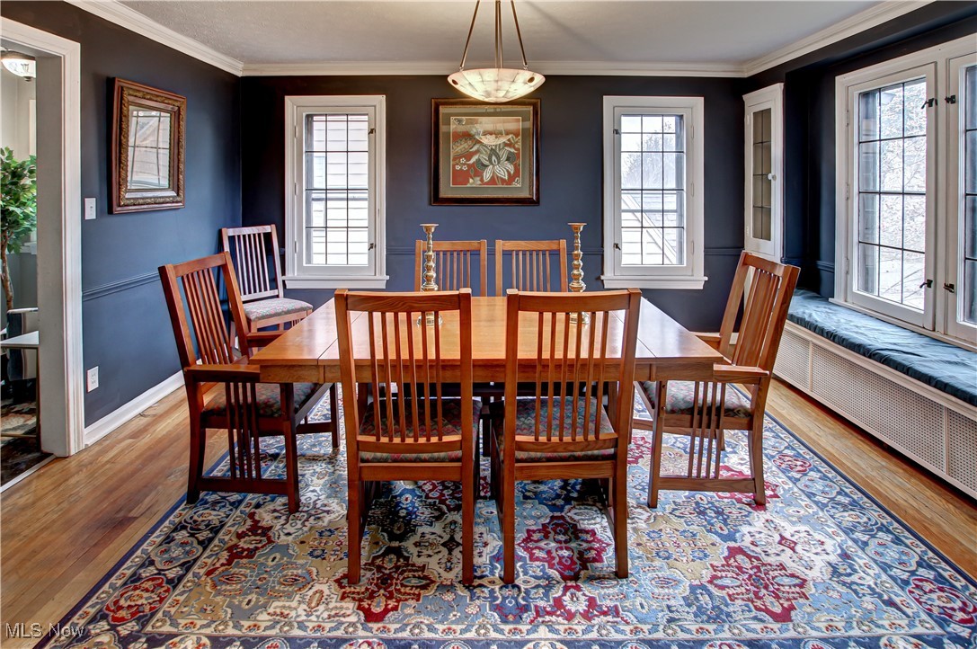 17800 Winslow Road Beachwood, OH 44122 - Photo 12 of 31 Dining area with crown molding, plenty of natural light, and light hardwood / wood-style floors