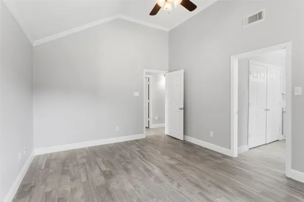 an empty room with wooden floor