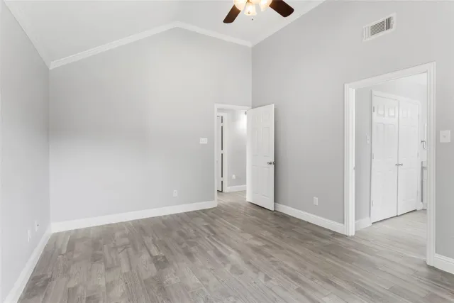 an empty room with wooden floor