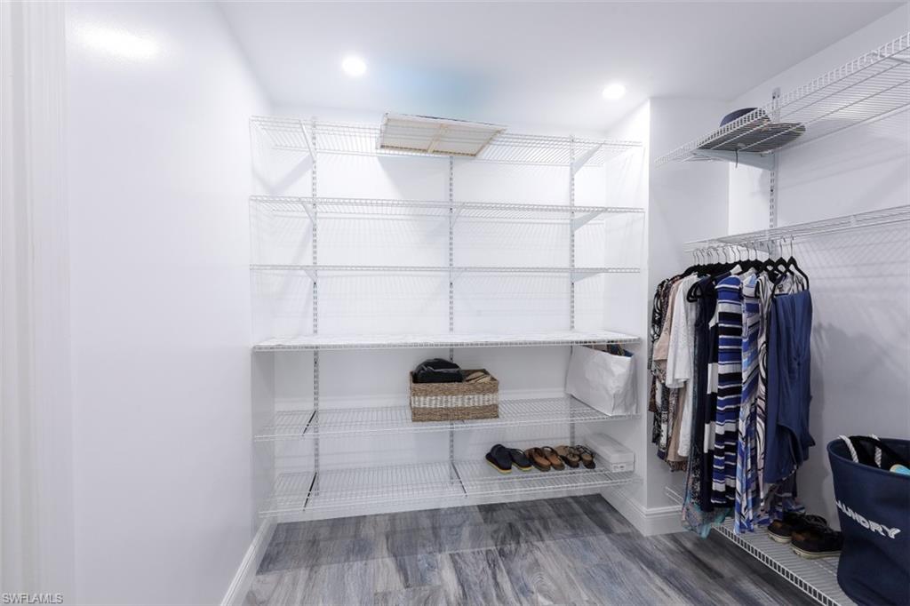 1 Bluebill Avenue, Unit 803 Naples, FL 34108 - Photo 14 of 19 a view of a livingroom with wooden floor and closet