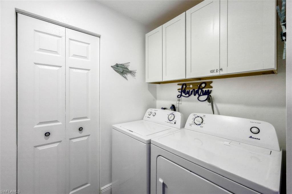 1 Bluebill Avenue, Unit 803 Naples, FL 34108 - Photo 16 of 19 a utility room with dryer and washer