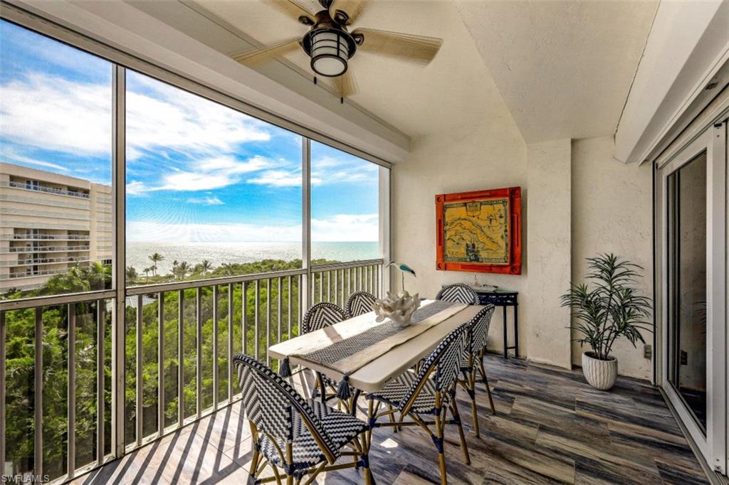 1 Bluebill Avenue, Unit 803 Naples, FL 34108 - Photo 18 of 19 a balcony with furniture and a view of lake