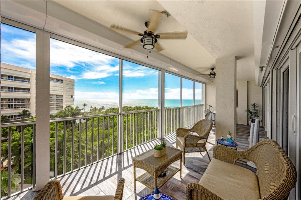 1 Bluebill Avenue, Unit 803 Naples, FL 34108 - Photo 2 of 19 a living room with furniture and a large window