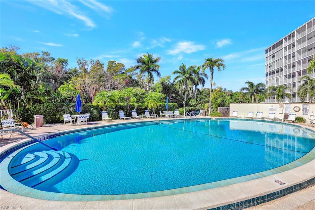 1 Bluebill Avenue, Unit 803 Naples, FL 34108 - Photo 3 of 19 a view of swimming pool from a balcony