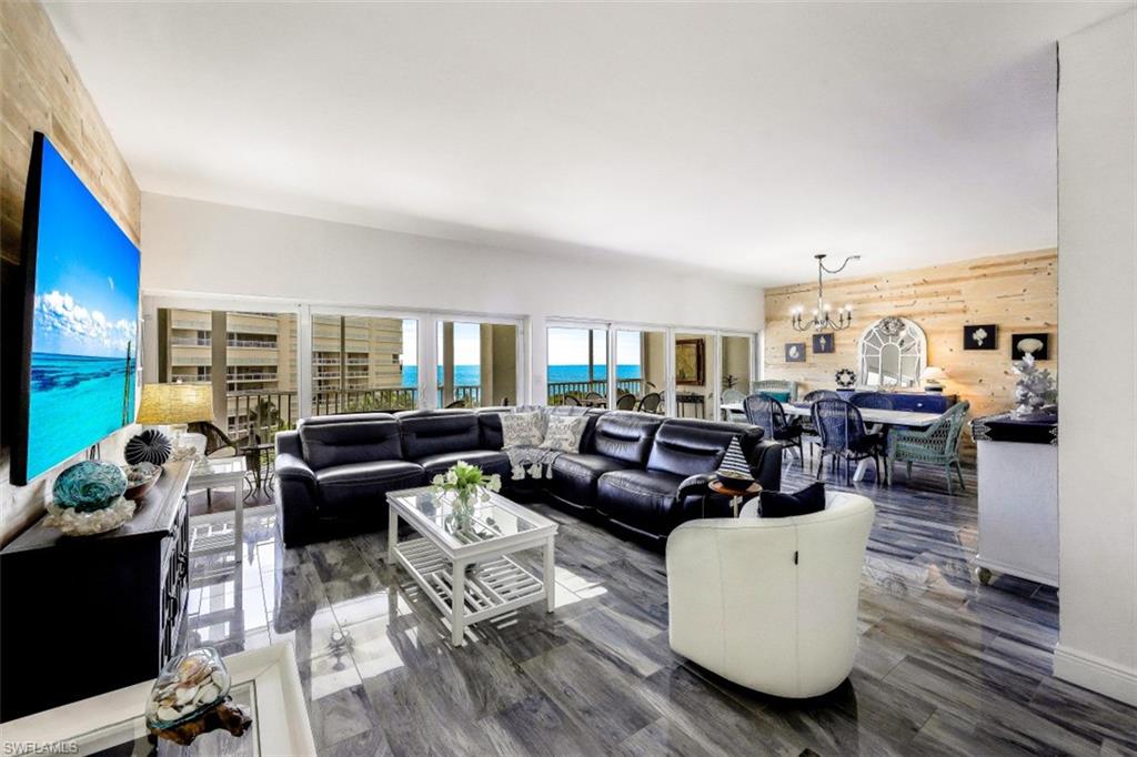 1 Bluebill Avenue, Unit 803 Naples, FL 34108 - Photo 7 of 19 a living room with furniture and a wooden floor