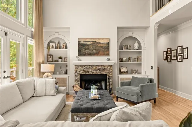 a living room with furniture and a fireplace