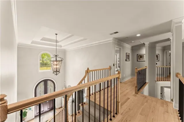 a view of a hallway with windows