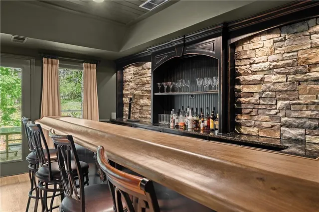 a view of a dining room with furniture and chandelier