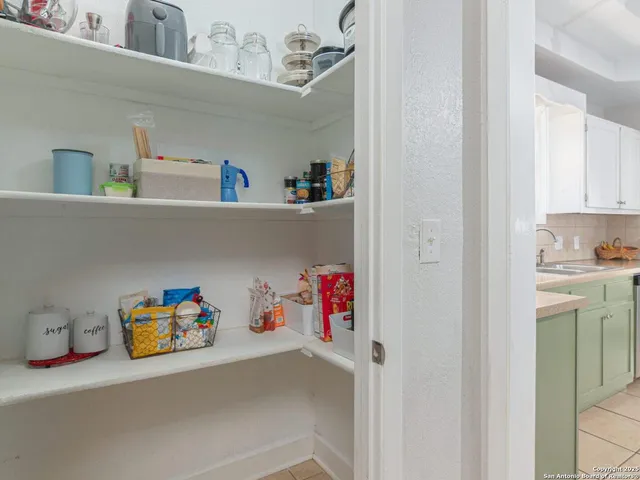 a utility room with toys and wooden floor
