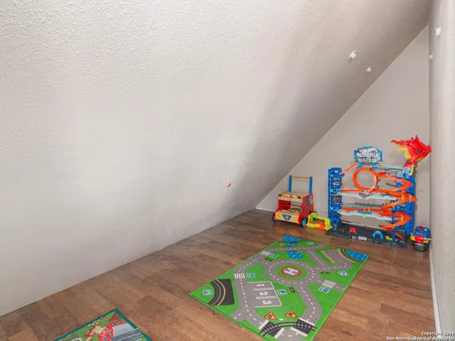 a room with toys and wooden floor