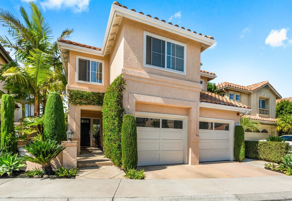 7 Monaco Dana Point, CA 92629 - Photo 2 of 32 a front view of a house with a yard