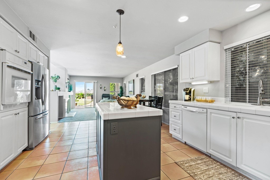 7 Monaco Dana Point, CA 92629 - Photo 12 of 32 a kitchen with counter top space cabinets and stainless steel appliances