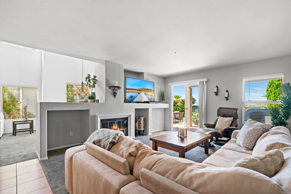 7 Monaco Dana Point, CA 92629 - Photo 14 of 32 a living room with furniture and a fireplace