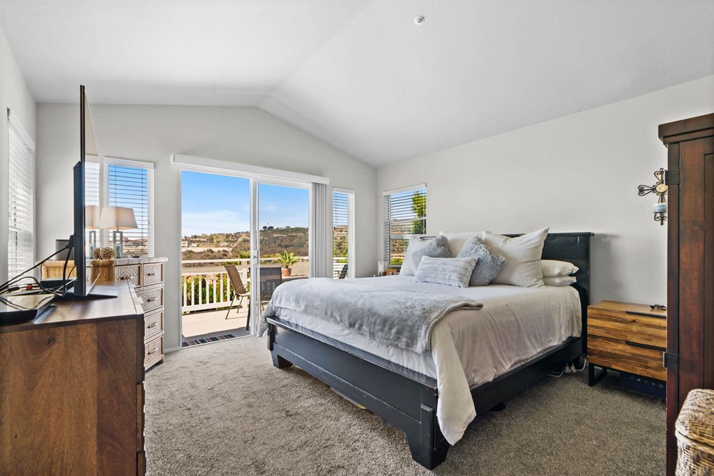 7 Monaco Dana Point, CA 92629 - Photo 15 of 32 a spacious bedroom with a bed and large windows