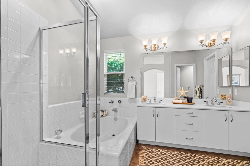 7 Monaco Dana Point, CA 92629 - Photo 18 of 32 a bathroom with a double vanity sink mirror and shower