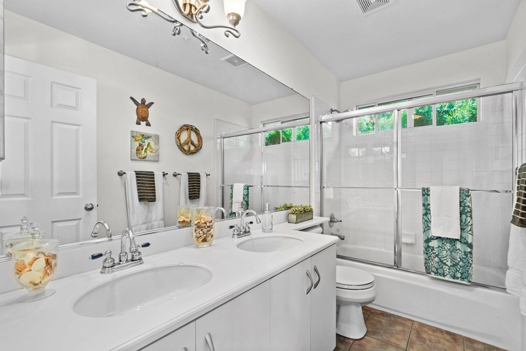 7 Monaco Dana Point, CA 92629 - Photo 22 of 32 a bathroom with a sink mirror vanity and toilet