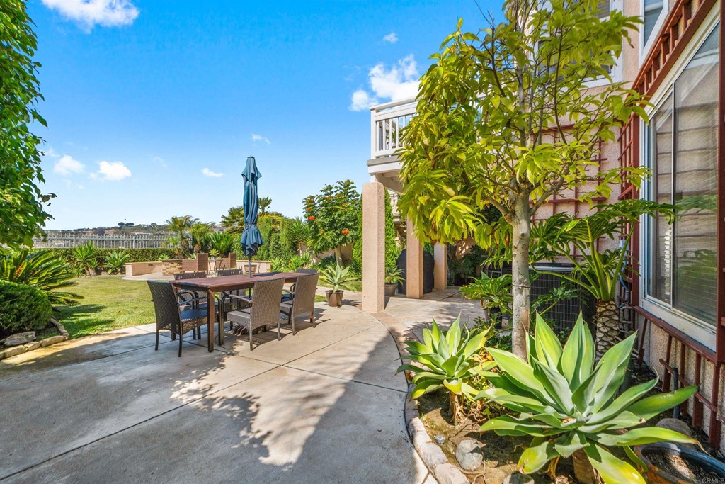 7 Monaco Dana Point, CA 92629 - Photo 26 of 32 a view of a patio with table and chairs and potted plants