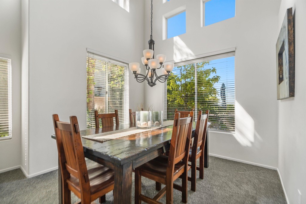 7 Monaco Dana Point, CA 92629 - Photo 6 of 32 a dining room with furniture potted plants and wooden floor