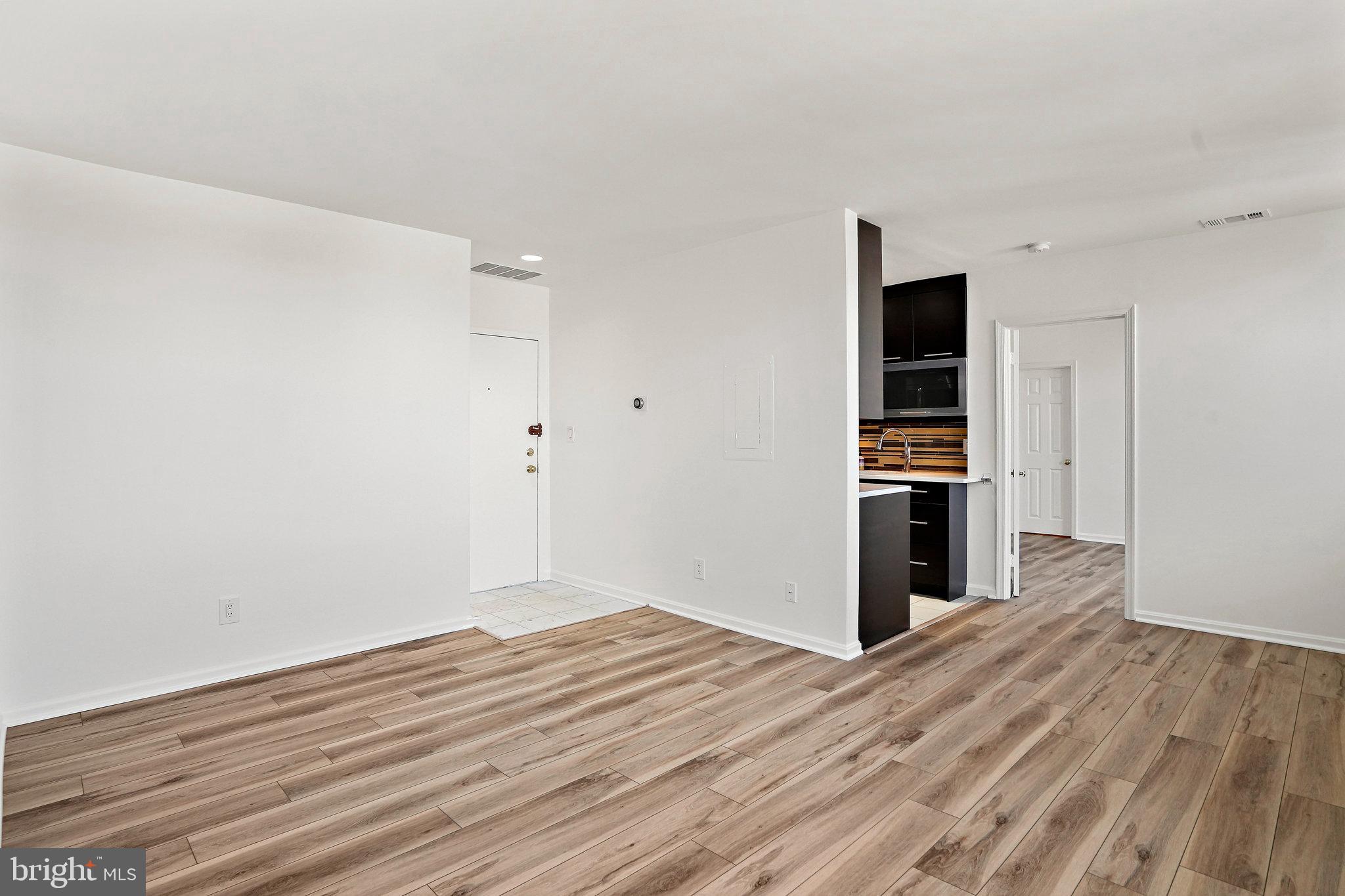 1920 S Street Northwest, Unit 804 Washington, DC 20009 - Photo 11 of 25 a view of empty room with wooden floor