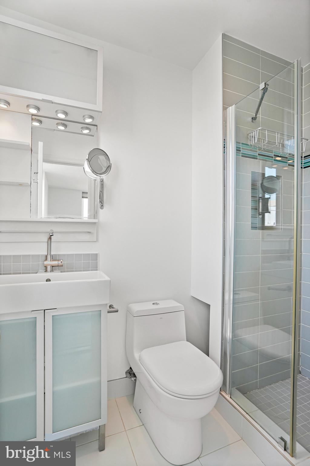 1920 S Street Northwest, Unit 804 Washington, DC 20009 - Photo 17 of 25 a bathroom with a toilet sink and shower