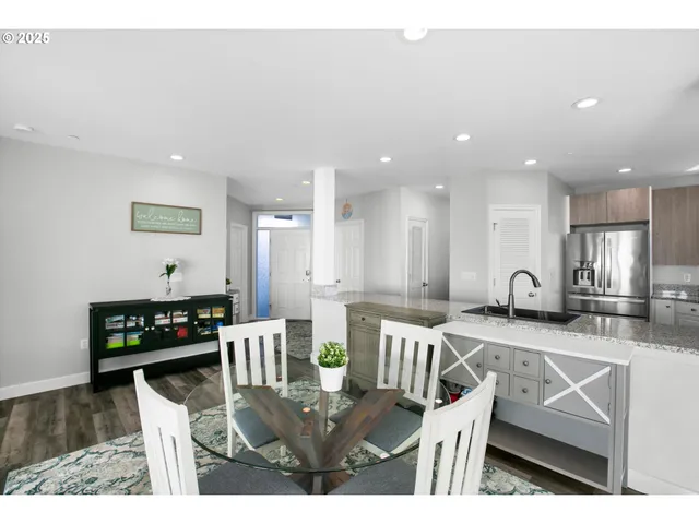 a view of kitchen with dining table and chairs