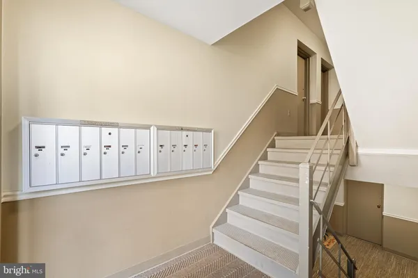 a view of a storage & utility room with dryer and washer