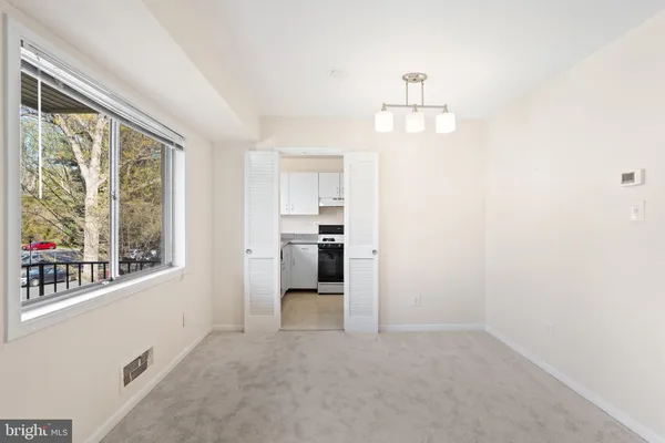 a view of a kitchen with a sink and a window