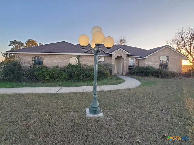 a view of a house with a yard and a sink