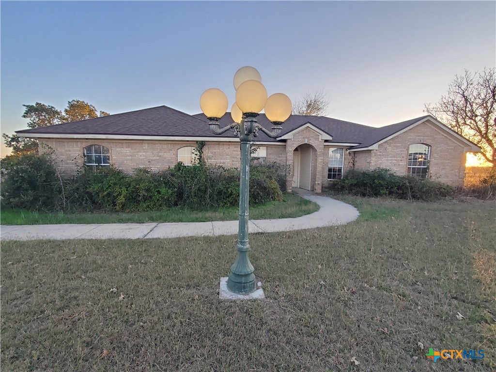 a view of a house with a yard and a sink