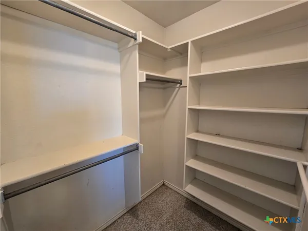 a view of an empty walk in closet