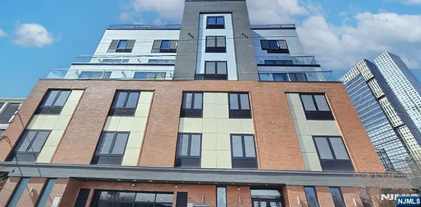 a front view of a building with lot of windows