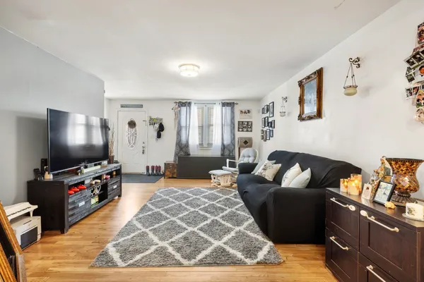a view of a play room with furniture and toys