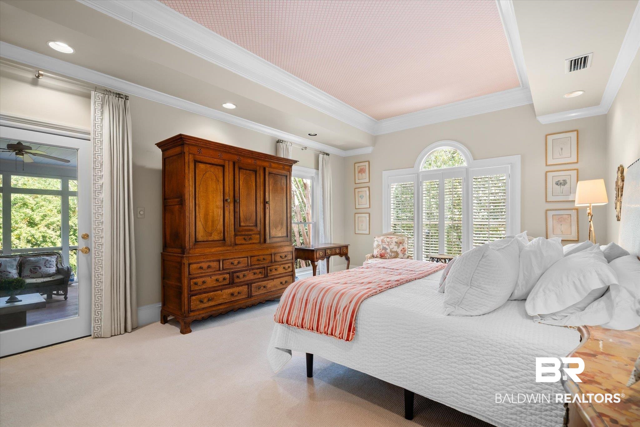 354 Dogwood Lane Mobile, AL 36608 - Photo 18 of 44 Bedroom featuring ornamental molding, access to exterior, multiple windows, and light colored carpet