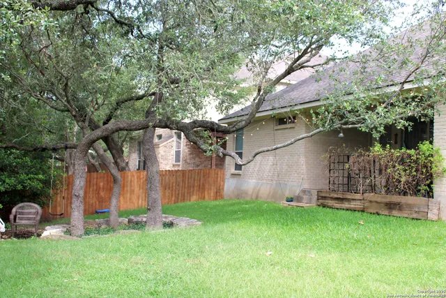 a backyard of a house with lots of green space